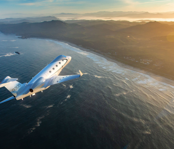 Super midsize jet Gulfstream G300 Flying over Ocean
