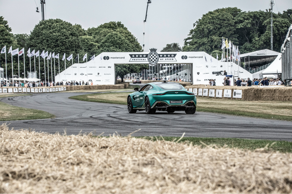 astin martin driving on race track at Goodwood Festival of Speed