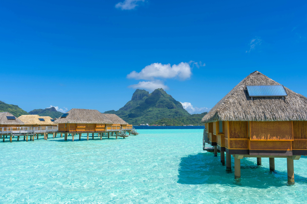 luxury island villa over crystal clear water in bora bora