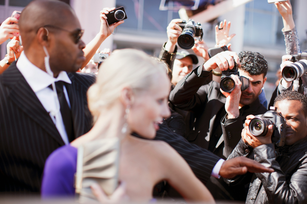 paparazzi photographing famous woman at the cannes film festival