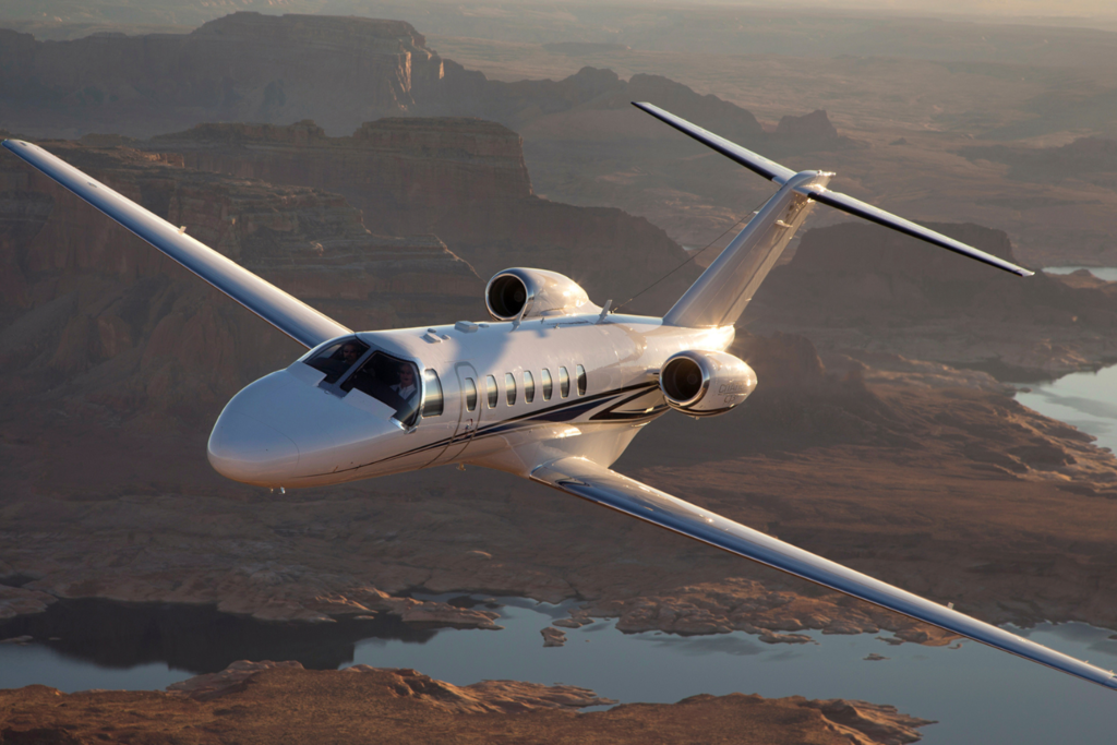 luxurios private jet flying over the water