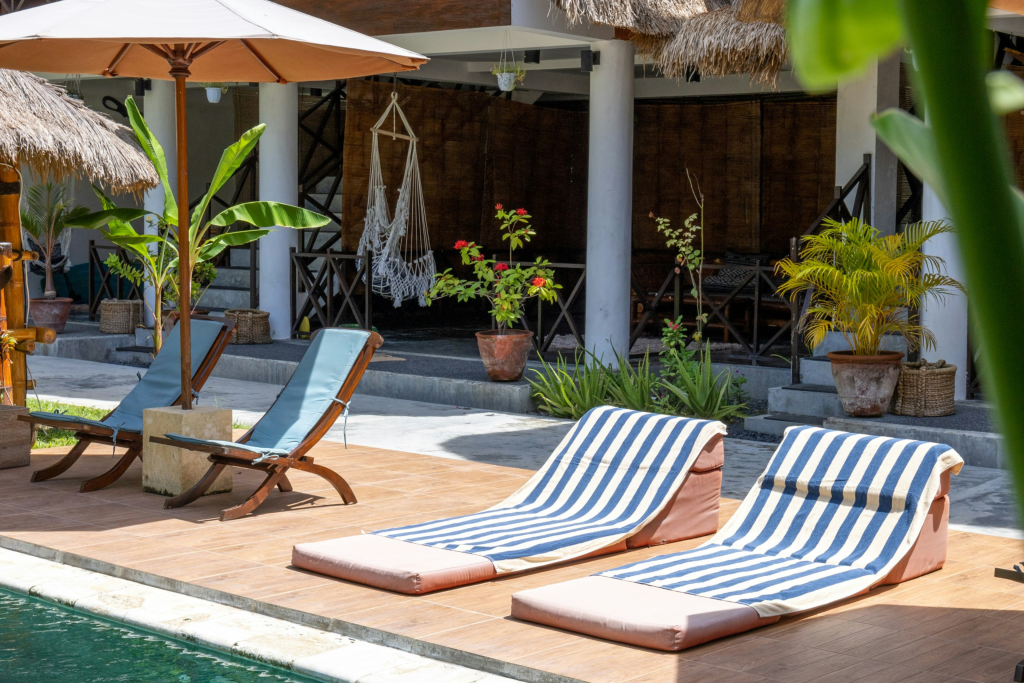 beach chairs, villa and pool in bali